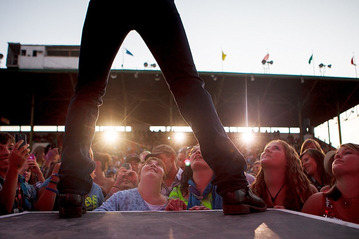 &lt;p&gt;Patrick Cote/Daily Inter Lake Fans look up as Rodney Atkins walks to the edge of the stage Wednesday night during the Northwest Montana Fair at the Flathead County Fairgrounds. Wednesday, Aug. 15, 2012 in Kalispell, Montana.&lt;/p&gt;