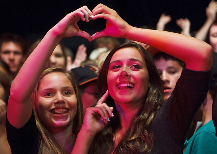 &lt;p&gt;Patrick Cote/Daily Inter Lake Rachel Fletcher, right, and Grace Dunnehoff put their hands together to create a heart Wednesday night during the Rodney Atkins' concert at the Flathead County Fairgrounds. Wednesday, Aug. 15, 2012 in Kalispell, Montana.&lt;/p&gt;