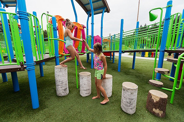 &lt;p&gt;Kaylee Patterson, 7, who suffered a pediatric stroke, steps down onto log features with the help of Addison Jonz, 6, during a gathering of Children&#146;s Hemiplegia and Stroke Association families Friday at McEuen Park in Coeur d&#146;Alene.&lt;/p&gt;