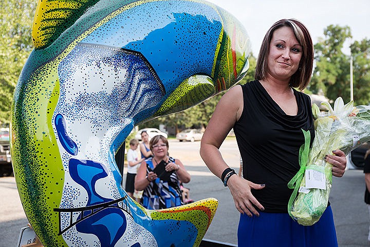 &lt;p&gt;The artist of the painted fish, Harmony Conley-Oaks, stands with her artwork Thursday at the Jacklin Arts and Cultural Center. She named the fish, Max, after its size.&lt;/p&gt;