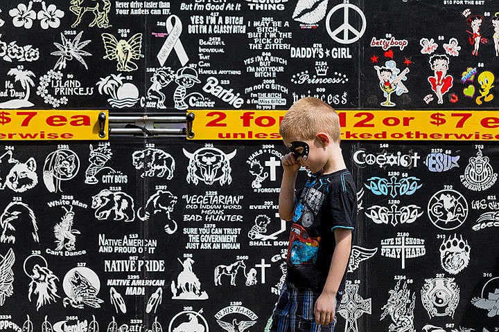 &lt;p&gt;Brady Belcher, 5, wipes some face paint from his nose while walking by a decal booth at the Post Falls Festival.&lt;/p&gt;