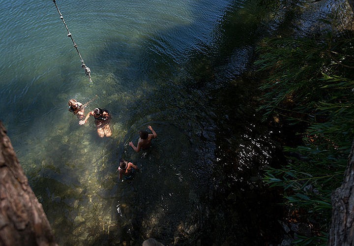 &lt;p&gt;A group of kids play in the waters of Hayden Lake near Honeysuckle Beach on Tuesday afternoon.&lt;/p&gt;