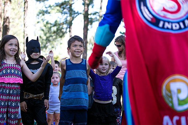 &lt;p&gt;From left, Ciana Chevalley, Elijah White, and Tobin Chevalley, listen to Recycle Man speak about the importance of recycling Thursday at North Park in Post Falls. The Post Falls Library hosted the educational event with the theme &#147;every hero has a story&#148;, and Recycle Man was there to celebrate the heroes that recycle junk.&lt;/p&gt;