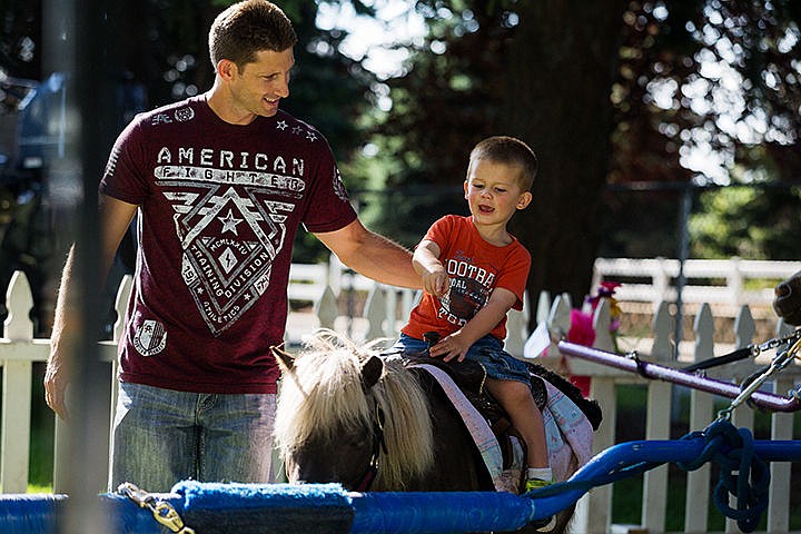 &lt;p&gt;Cooper Young, 2, enjoys a pony ride as his father Casey walks alongside Friday during Hayden Days at Hayden City Park.&lt;/p&gt;