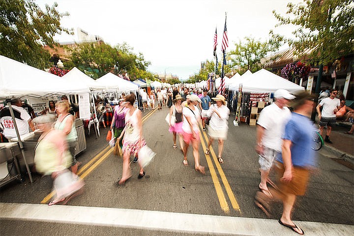 &lt;p&gt;People parade down Sherman Avenue for the Coeur d&#146;Alene Downtown Street Fair Saturday. The fair will be continuing on through Sunday.&lt;/p&gt;