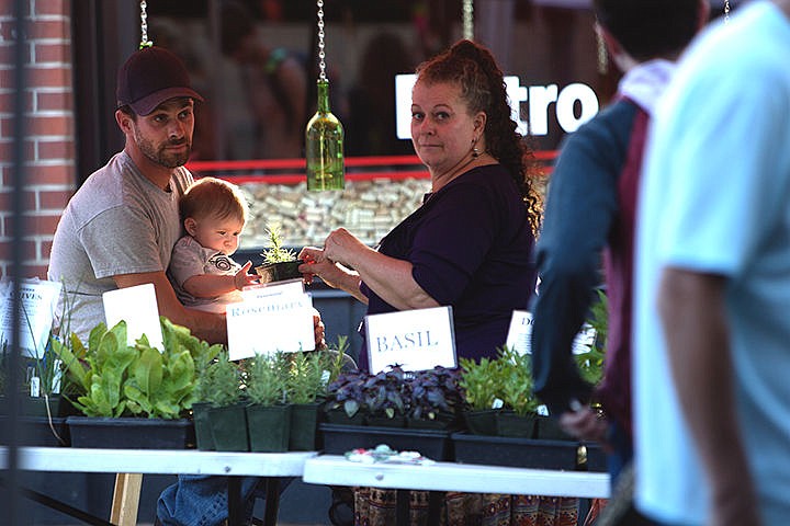 &lt;p&gt;7-month-old Darin Davenport is mesmerized by a plant while Farmers&#146; Market vendors Roger Robison, left and Carol Rondepierre-Robison enjoy their afternoon in downtown Coeur d&#146;Alene Wednesday.&lt;/p&gt;