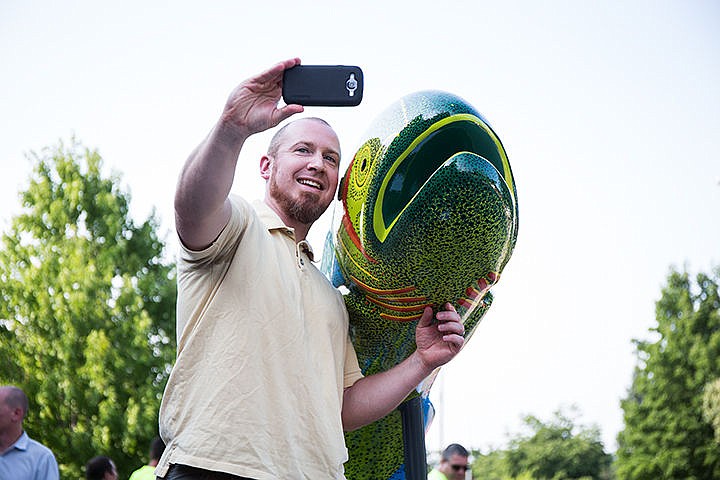 &lt;p&gt;Joe Malloy takes a selfie with the unveiled fish at Jacklin Arts and Cultural Center in Post Falls Thursday. The fish went on to be installed at a median on Spokane Street near City Hall.&lt;/p&gt;