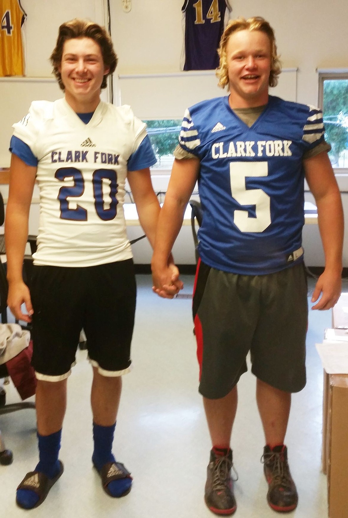 &lt;p&gt;&lt;/p&gt;&lt;p&gt;To solidify the bond between players, Clark Fork Cats head football coach, Jeff Schultz requires his players to hold hands when they go out onto the field. &#147;You don&#146;t just &#145;like&#146; your teammates, you &#145;love&#146; your teammates,&#148; he said. Cat players, Isaac Warren and Nick Turnbull show off the new team jerseys, and team bond. (Photo by Kathleen Woodford/Mineral Independent)&lt;/p&gt;