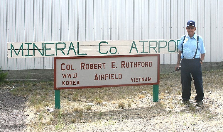 &lt;p&gt;Colonel Robert E. Ruthford stands next to the airport sign
dedicated in his honor at the Fly-In.&#160;&lt;/p&gt;