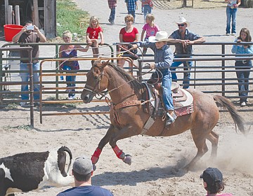 &lt;p&gt;Gavin Knutson swings a lasso in preparation to rope a calf during the breakaway roping.&lt;/p&gt;