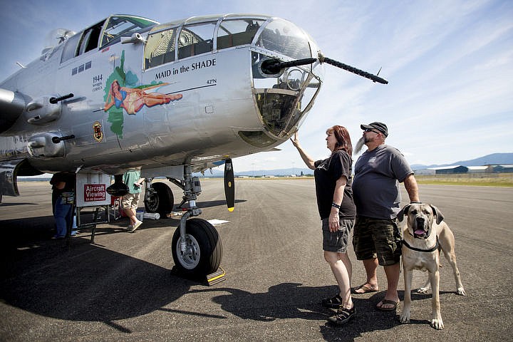 &lt;p&gt;Shelly Gurr, Rick Linscott and Tank the dog admire the 1944 B-25 &quot;Maid in the Shade,&quot; on Thursday, Aug. 18, 2016, at the Coeur d'Alene Airport. With a 67.5 foot wingspan and a length of 52 feet, 11 inches, the war plane has a top speed of 275 miles-per-hour and can carry a crew of six. The plane flew 15 combat missions over Italy in late 1944, mostly targeting railway bridges.&lt;/p&gt;