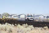 Half acre burns in Moses Lake
