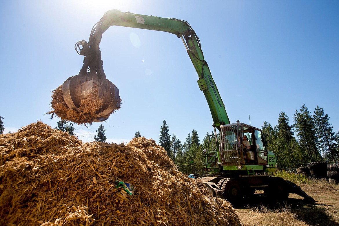 &lt;p&gt;Jack Hern and his 8-year-old daughter Ellie operate a material handler to move ground-up tree stumps on Wednesday at Hern Iron Works in Coeur d'Alene. Hern and his business partner Dan Edwards plan to build a strip mall and storage unit facility on Hern's property in the next two years.&lt;/p&gt;