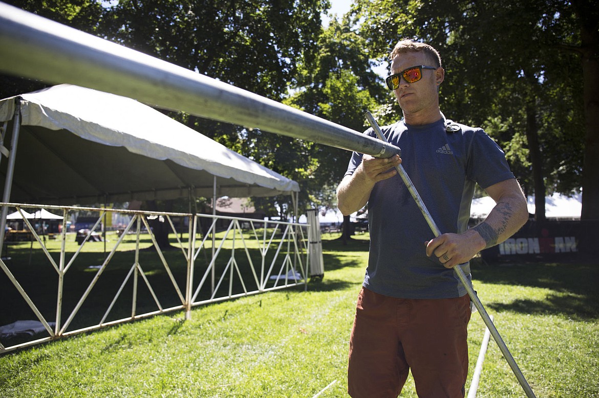 &lt;p&gt;Landy Root sets up bike racks at City park on Wednesday prior to Ironman.&lt;/p&gt;