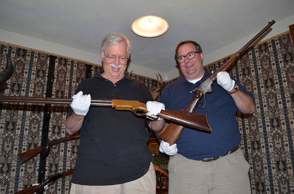 &lt;p&gt;&lt;strong&gt;Garry James&lt;/strong&gt;, senior editor of Guns &amp; Ammo Magazine,(left) and Philip Schreier, senior curator for the NRA, inspect two of the firearms from Charles E. Conrad's original collection. James holds the Henry repeating rifle, a .44 caliber rifle only manufactured between 1860-1866. Schreier holds a Sporterized Spencer Repeating Carbine; the last one manufactured in 1865. (Seaborn Larson/Daily Inter Lake)&lt;/p&gt;