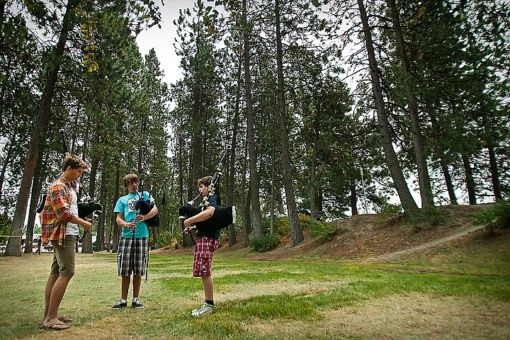 &lt;p&gt;BEN BREWER/Press Thomas Nichini, left, practices a three-part version of Scotland the Brave alongside Logan Fraser and Aaron Sentell on the grassy lawn adjacent to the North Idaho College beach on Monday. The camp, which began in 1970, features around eighty pipers from throughout the Northeast and will feature two concerts on Tuesday and Thursday evening at NIC.&lt;/p&gt;