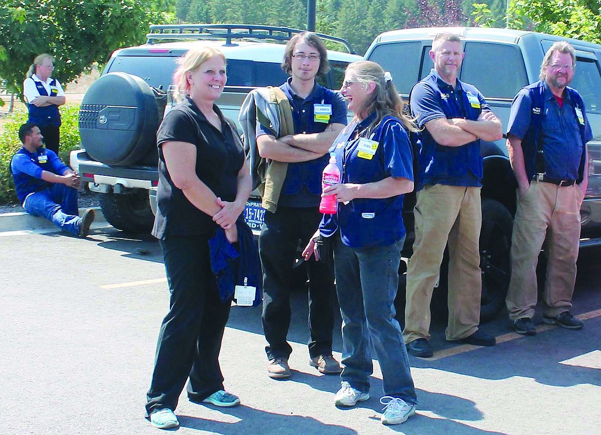 &lt;p&gt;Employees take a quick break while waiting for firefighters to clear Walmart.&lt;/p&gt;