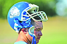 Chad Anderson takes a break during the Mission High School football practice.