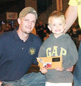 &lt;p&gt;Jaxon Howe, right, holding the Igniters Humanitarian Award won by his father Eric Howe for saving the life of his girl friend and three-year-old son Jaxson in the Dec. 11, 2013 fire at Pine Tree Plaza in Troy. He also risked his life by reentering the burning building to notify other sleeping tenants..&lt;/p&gt;
