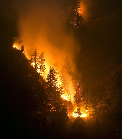 &lt;p&gt;Fire creeps slowing down the western canyon wall above the Wood River in Hailey where firefighters continue to battle the Beaver Creek Fire, on Saturday night.&lt;/p&gt;