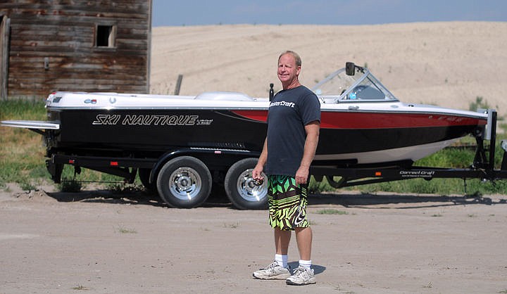 &lt;p&gt;Greg Alsbury poses with his boat at the Rosewater development on Tuesday north of Kalispell. Alsbury is a project consultant for Rosewater.&lt;/p&gt;