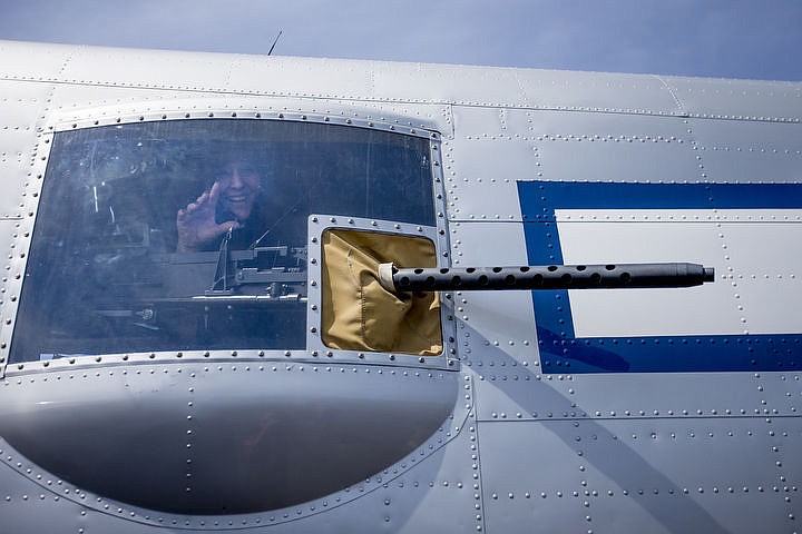 &lt;p&gt;Shelly Gurr waves out the turret window of the &quot;Maid in the Shade&quot; B-25 war plane near a .50-caliber machine gun on Thursday at the Coeur d'Alene Airport. The 1944 &quot;Maid in the Shade&quot; B-25 war plane will be at the airport throughout the weekend. With a 67.5 foot wingspan and a length of 52 feet, 11 inches, the war plane has a top speed of 275 miles-per-hour and can carry a crew of six. The plane flew 15 combat missions over Italy in late 1944, mostly targeting railway bridges.&lt;/p&gt;