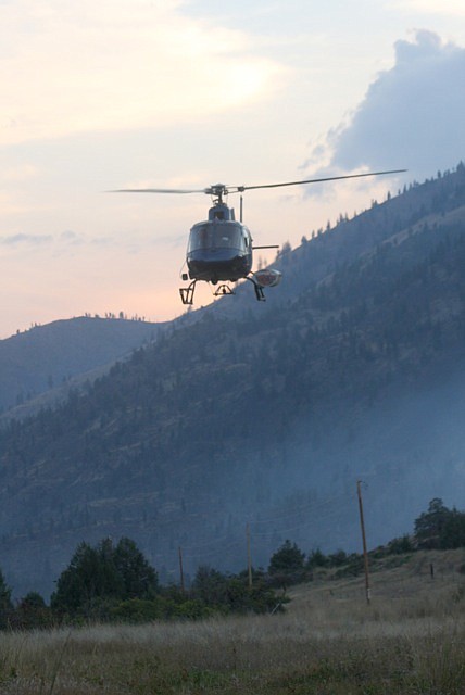&lt;p&gt;One of the helicopters takes off from a place near the Perma Bridge Fire Aug. 19.&lt;/p&gt;