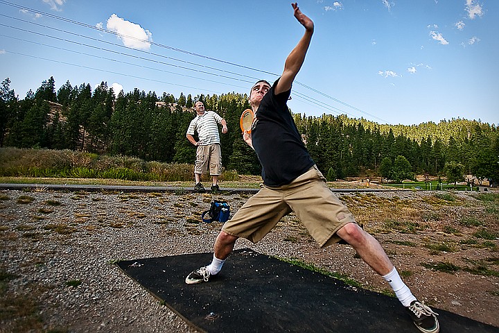 &lt;p&gt;BEN BREWER/Press William Everingham of Coeur d'Alene winds up for a &quot;hammer&quot; frisbee golf drive on the first hole of the Cherry Hill frisbee golf course on Wednesday as Max Everingham stretches out. The frisbee golfers were warming up for competitive league play that began at 6:00 PM at the 15th Avenue park.&lt;/p&gt;