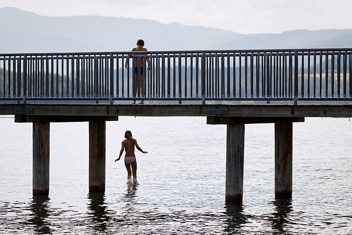 &lt;p&gt;SHAWN GUST/Press 11-year-old Connie Peart plunges into the waters of Lake Coeur d'Alene near Independence Point Wednesday as her friend, Gabby Phillips, watches from above. With a new school year beginning in less than a month, area students are taking advantage of favorable weather while participating various summer activities.&lt;/p&gt;