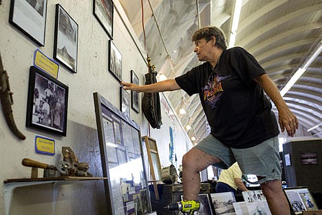 &lt;p&gt;Sharon Panabaker of Hayden hangs a historic photograph at the Hayden Historical Preservation Commission exhibit Tuesday at the Kootenai Couny Fairgrounds, Building 7. The building will house a handful of exhibits from historical societies from around Kootenai County during the North Idaho Fair and Rodeo, which takes place Wednesday through Sunday.&lt;/p&gt;