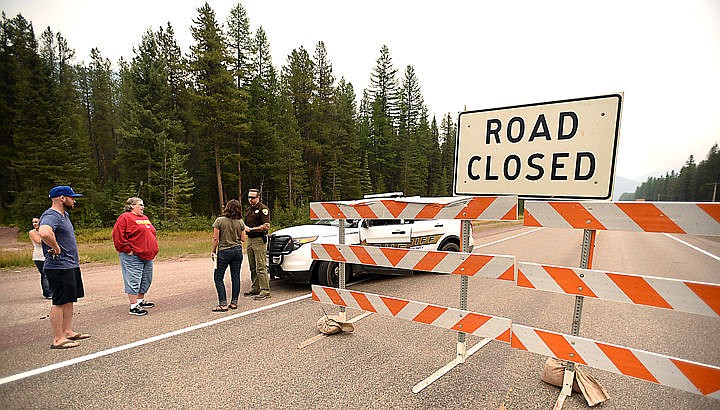 &lt;p&gt;&lt;strong&gt;Flathead County&lt;/strong&gt; Sheriff&#146;s Deputy Nelson Grant explains to drivers why U.S. 2 is closed near Essex on Thursday afternoon. The growing Sheep Fire prompted closure of the highway at 3 p.m. Thursday. (Brenda Ahearn photos/Daily Inter Lake)&lt;/p&gt;