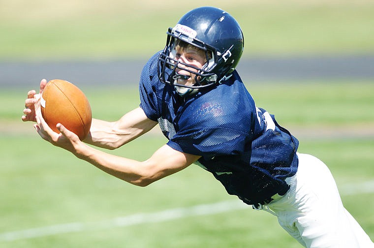 &lt;p&gt;Sophomore Kaden Schoenthal dives for a catch Tuesday afternoon during Glacier's football practice at Glacier High School. Aug. 20, 2013 in Kalispell, Montana. (Patrick Cote/Daily Inter Lake)&lt;/p&gt;