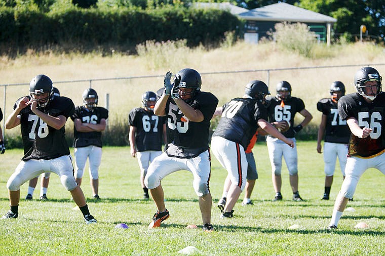 &lt;p&gt;Lineman perform blocking drills Tuesday morning during Flathead's football practice at Legends Field. Aug. 20, 2013 in Kalispell, Montana. (Patrick Cote/Daily Inter Lake)&lt;/p&gt;