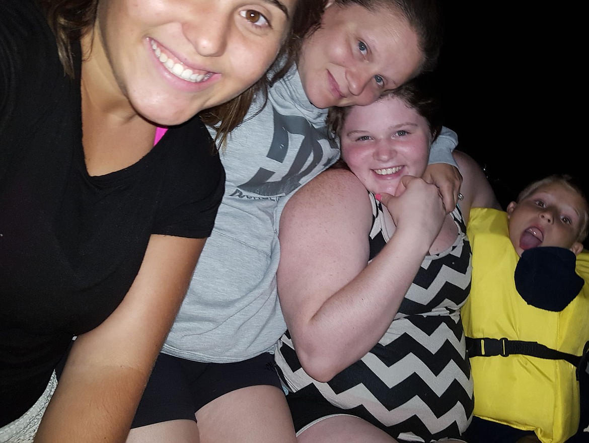 &lt;p&gt;Samantha Krous, 20, Misty Tucker, 9, Katie Aragon, 19, and Change Tucker, 6, take a photo together Thursday night on Lake Coeur d'Alene while waiting for rescue. Krous told The Press that the photo was an attempt by the two older girls to cheer up the the two young boys, who became scared when their family's boat broke down and left them stranded on the lake for hours in the middle of the night.&lt;/p&gt;