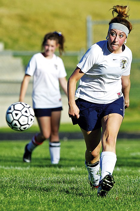 &lt;p&gt;Timberlake High's Jessie Jo Skala blasts the ball down the pitch to her teammate during the second half.&lt;/p&gt;