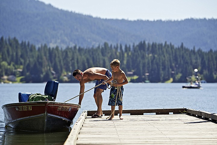 &lt;p&gt;JEROME A. POLLOS/Press Michael Johnson, 7, helps his father, Adam Johnson, load their boat Thursday after an afternoon of fishing and playing on Hayden Lake. The Sportsman Park boat ramp at Hayden Lake was recently expanded and improved by creating more than 40 parking spaces and the access road can now accommodate two vehicles. The new boat ramp is 20 feet long and has an expanded radius to back vehicles with trailers down the ramp, making boat launching faster, safer and easier, according to the Idaho Department of Fish and Game.&lt;/p&gt;