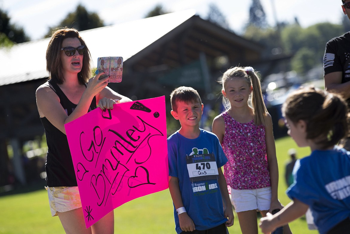 &lt;p&gt;LOREN BENOIT/Press Standing next to her children Gus and Ariana, Causja Wohletz, left, encourages her niece, Brynley, as she races in the IronKids Coeur d'Alene Fun Run on Saturday at McEuen Park.&lt;/p&gt;