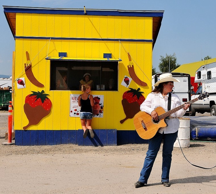 Betsy Mullen accompanies her husband on an acoustic bass guitar and occasionally provides vocal harmonies to their tunes.