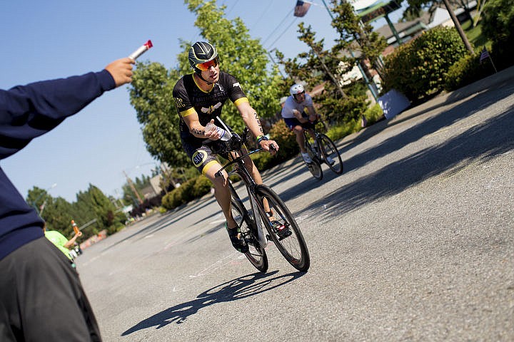 &lt;p&gt;More than 1,300 athletes from around the world gathered on Coeur d'Alene's City Beach on the morning of August 21, 2016 for the start of the 14th annual Ironman Coeur d'Alene triathlon. Participants were challenged to a 2.4-mile open water swim in Lake Coeur d'Alene, followed by a 122-mile bike ride and finishing the race with a 26.2-mile run. Thousands of spectators cheered on the athletes as they raced through the 94-degree weather for the event. To purchase photo, please visit www.cdapress.com/photos&lt;/p&gt;