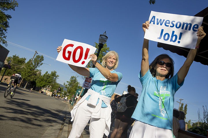 &lt;p&gt;JAKE PARRISH/Press Ann Johnson, left, and Laura Koepke cheer on Ironman athletes as they race the bike portion on Sherman Avenue.&lt;/p&gt;