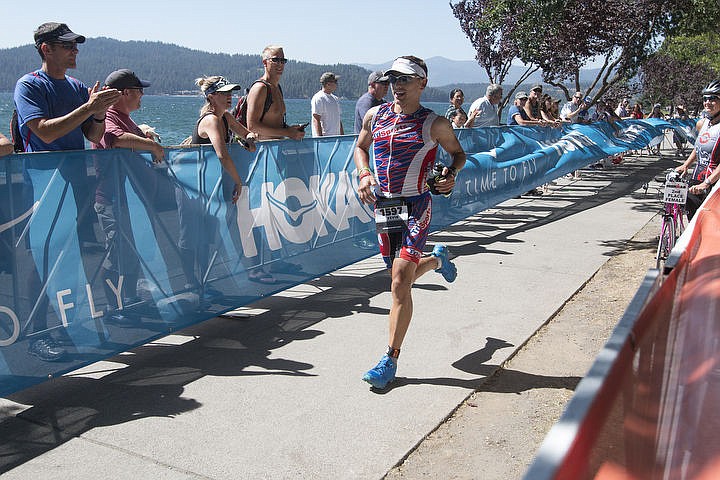 &lt;p&gt;More than 1,300 athletes from around the world gathered on Coeur d'Alene's City Beach on the morning of August 21, 2016 for the start of the 14th annual Ironman Coeur d'Alene triathlon. Participants were challenged to a 2.4-mile open water swim in Lake Coeur d'Alene, followed by a 122-mile bike ride and finishing the race with a 26.2-mile run. Thousands of spectators cheered on the athletes as they raced through the 94-degree weather for the event. To purchase photo, please visit www.cdapress.com/photos&lt;/p&gt;