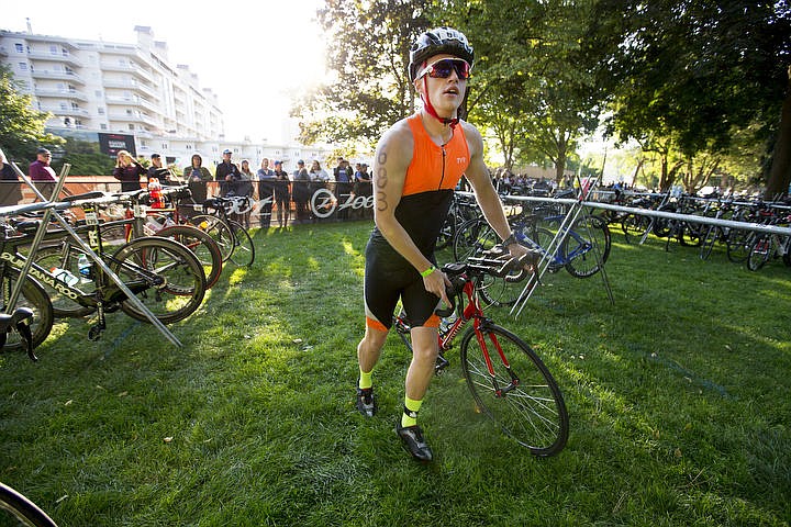 &lt;p&gt;More than 1,300 athletes from around the world gathered on Coeur d'Alene's City Beach on the morning of August 21, 2016 for the start of the 14th annual Ironman Coeur d'Alene triathlon. Participants were challenged to a 2.4-mile open water swim in Lake Coeur d'Alene, followed by a 122-mile bike ride and finishing the race with a 26.2-mile run. Thousands of spectators cheered on the athletes as they raced through the 94-degree weather for the event. To purchase photo, please visit www.cdapress.com/photos&lt;/p&gt;