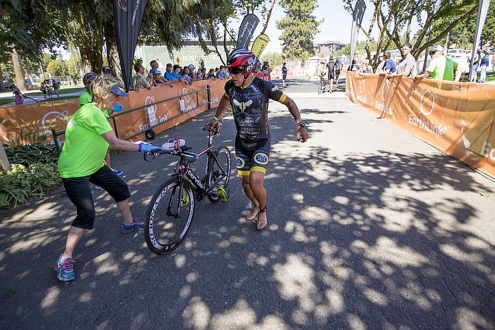 &lt;p&gt;More than 1,300 athletes from around the world gathered on Coeur d'Alene's City Beach on the morning of August 21, 2016 for the start of the 14th annual Ironman Coeur d'Alene triathlon. Participants were challenged to a 2.4-mile open water swim in Lake Coeur d'Alene, followed by a 122-mile bike ride and finishing the race with a 26.2-mile run. Thousands of spectators cheered on the athletes as they raced through the 94-degree weather for the event. To purchase photo, please visit www.cdapress.com/photos&lt;/p&gt;