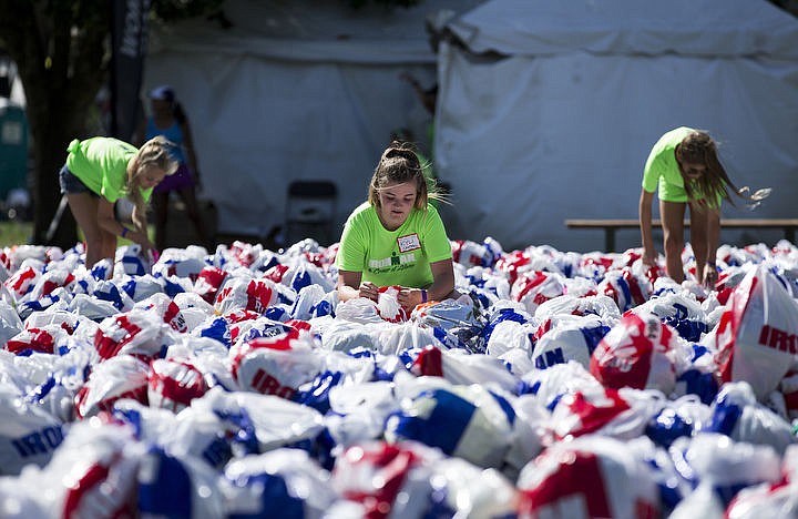 &lt;p&gt;LOREN BENOIT/Press More than 1,300 athletes from around the world gathered on Coeur d'Alene's City Beach on the morning of August 21, 2016 for the start of the 14th annual Ironman Coeur d'Alene triathlon. Participants were challenged to a 2.4-mile open water swim in Lake Coeur d'Alene, followed by a 122-mile bike ride and finishing the race with a 26.2-mile run. Thousands of spectators cheered on the athletes as they raced through the 94-degree weather for the event.&lt;/p&gt;