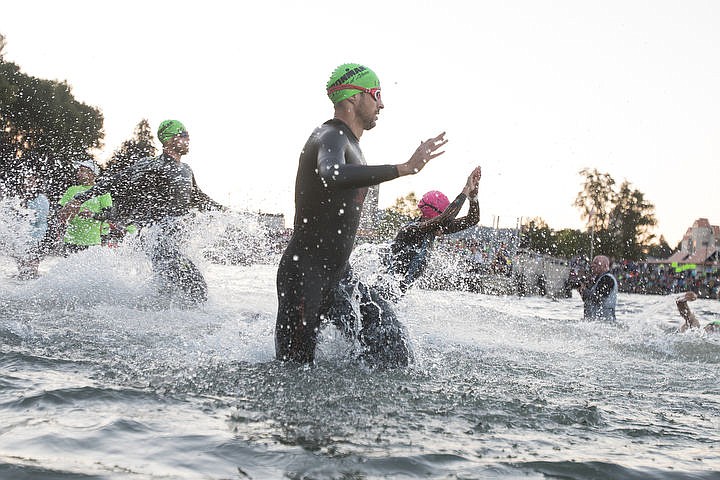 &lt;p&gt;More than 1,300 athletes from around the world gathered on Coeur d'Alene's City Beach on the morning of August 21, 2016 for the start of the 14th annual Ironman Coeur d'Alene triathlon. Participants were challenged to a 2.4-mile open water swim in Lake Coeur d'Alene, followed by a 122-mile bike ride and finishing the race with a 26.2-mile run. Thousands of spectators cheered on the athletes as they raced through the 94-degree weather for the event. To purchase photo, please visit www.cdapress.com/photos&lt;/p&gt;