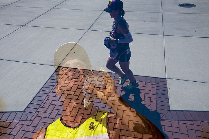 &lt;p&gt;In this in-camera double-exposure, Ironman athletes feel the heat during the 26.2-mile running portion of the 14th annual Ironman Coeur d'Alene triathlon on Sunday, Aug. 21, 2016.&lt;/p&gt;