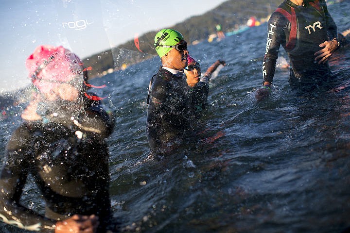 &lt;p&gt;In this in-camera double-exposure, Ironman athletes dash out of Lake Coeur d'Alene to make their way to the swim-to-bike transition stage during Ironman Coeur d'Alene triathlon on Sunday, August 21, 2016.&lt;/p&gt;