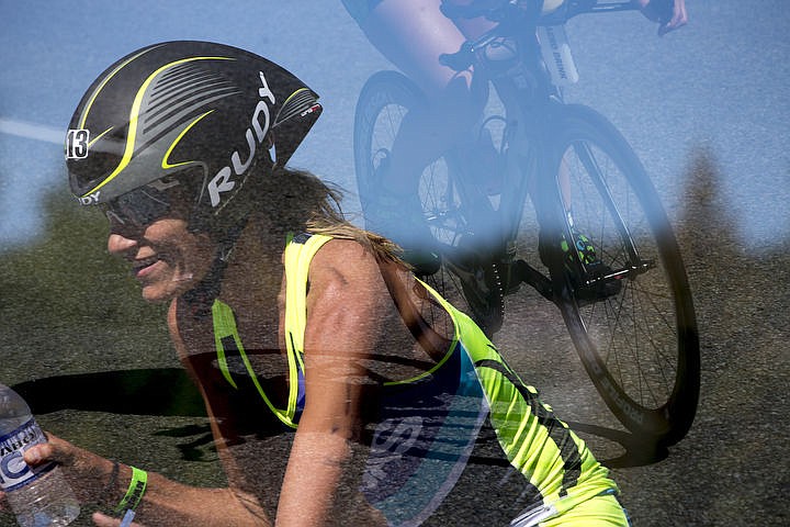 &lt;p&gt;JAKE PARRISH/Press In this in-camera double-exposure, Kristen Yax and a competitor race the 112-mile bike portion of the Ironman Coeur d'Alene triathlon.&lt;/p&gt;