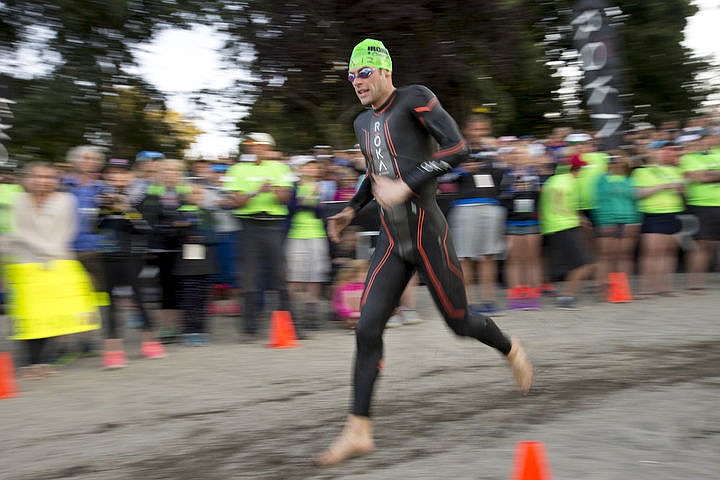 &lt;p&gt;JAKE PARRISH/Press Tim Cotreau of Manchester, New Hampshire navigates the turn-around corner of the 2.4 mile swim portion.&lt;/p&gt;