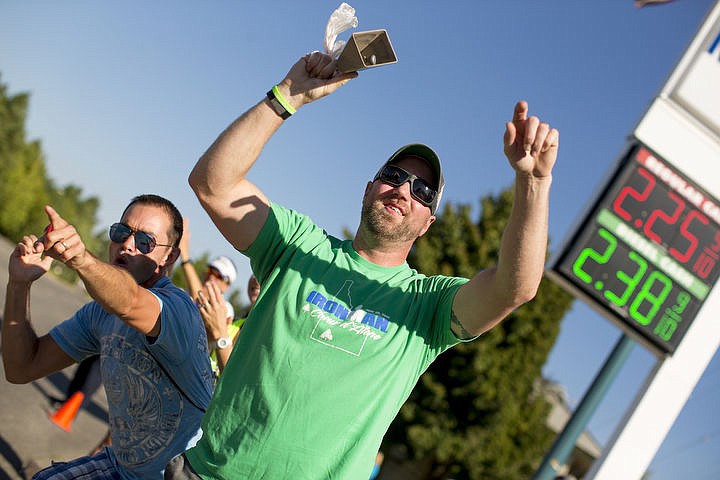 &lt;p&gt;JAKE PARRISH/Press Sean Johnson, left, and Joshua Pare cheer on Ironman athletes as they make their way down Northwest Boulevard during the bike portion of the triathlon.&lt;/p&gt;